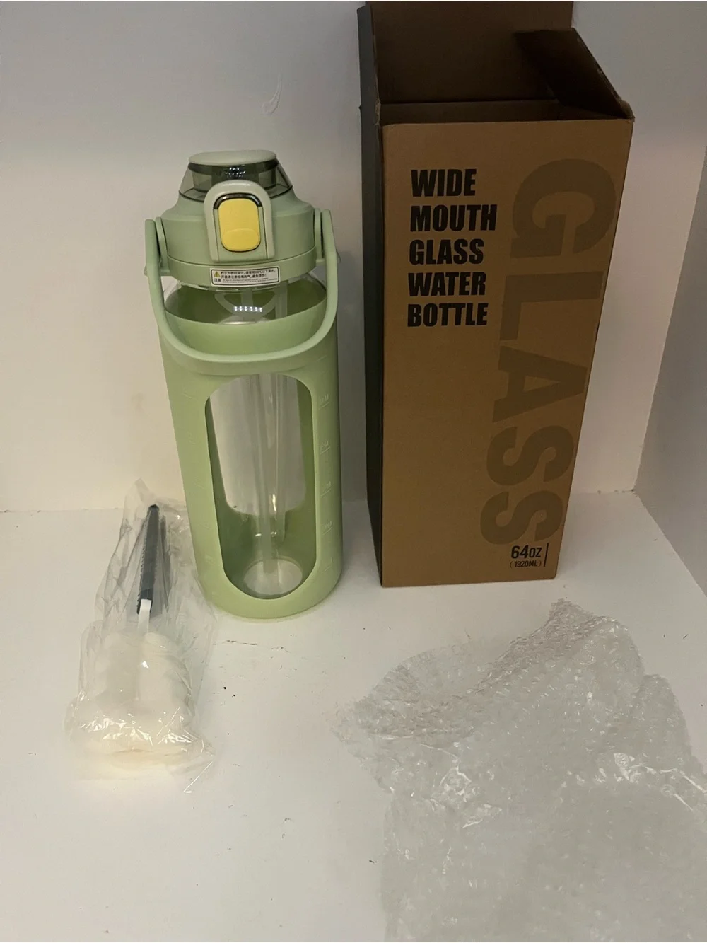 64 fl oz Wide Mouth Glass Water Bottle Green Silicone Sleeve, Flip-Top, Straw